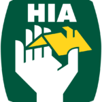 The hia logo with a hand holding a house.