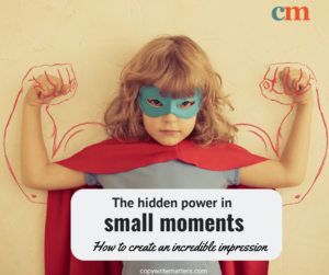A child in a super hero pose with muscled arms drawn on
