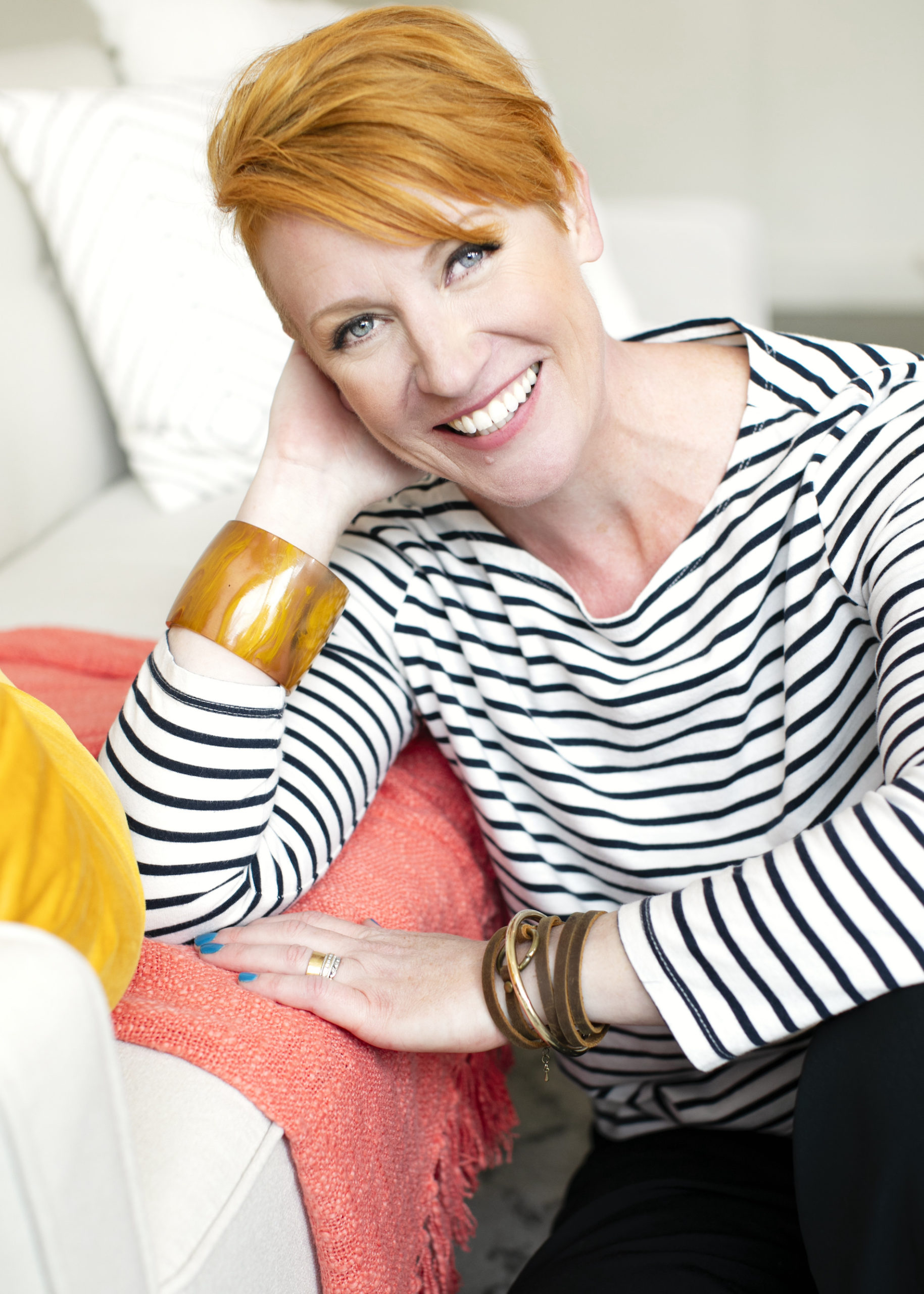 Belinda Weaver wears a stripey shirt and grins at the camera