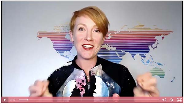 A video of a woman in front of a world map.