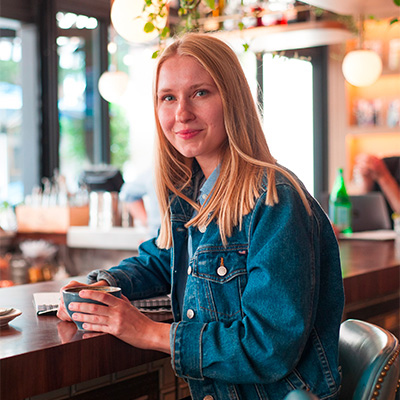 A woman wearing a denim jacket.