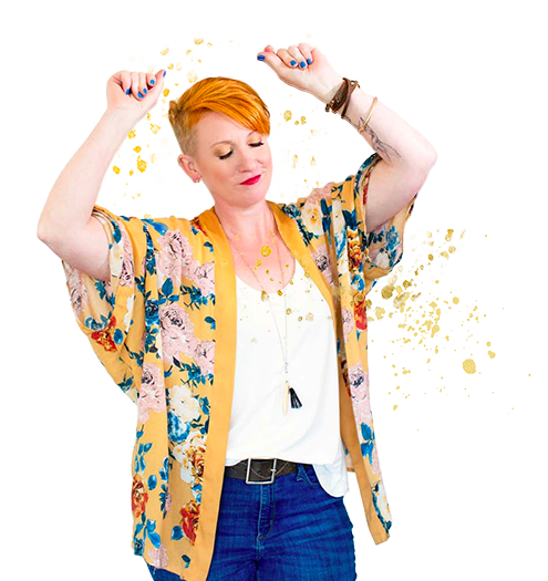 A woman in jeans and a floral kimono.