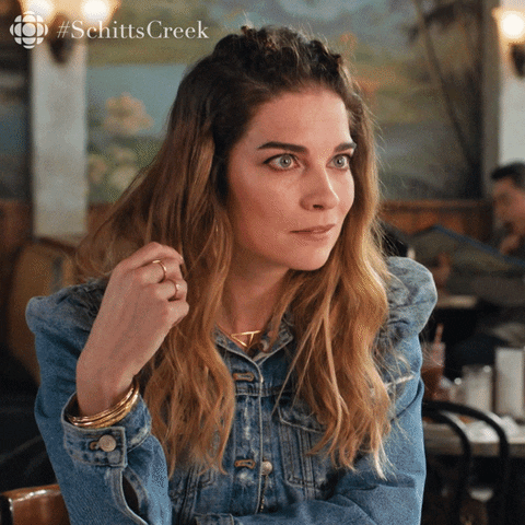 Alexa puts her hands under her chin, looking intensely interested.